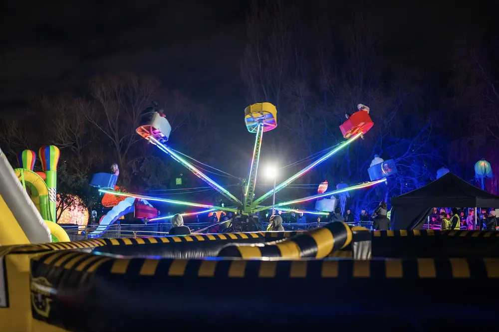 Amusement ride lit up at night